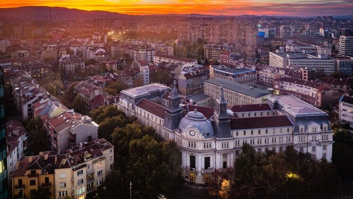 a landscape view of the town of Sofia at sunset