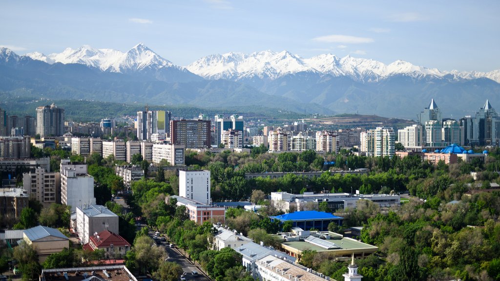 Photo of Almaty with mountains in the background